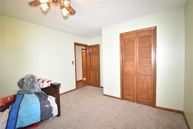 211 Southside Ct, Excelsior Springs, MO 64024 - carpeted bedroom with ceiling fan and a closet