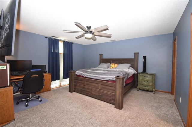 211 Southside Ct, Excelsior Springs, MO 64024 - bedroom with carpet, a desk, and a ceiling fan