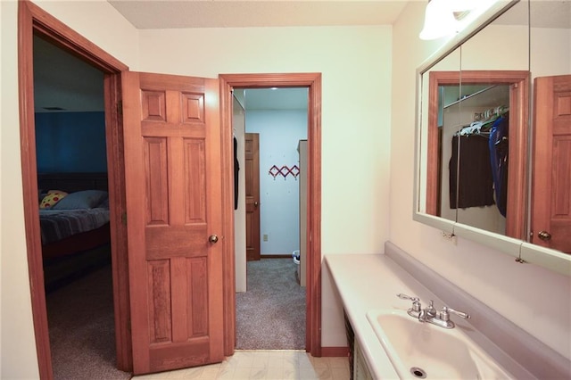 211 Southside Ct, Excelsior Springs, MO 64024 - bathroom featuring vanity and ensuite bathroom