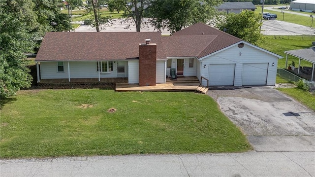 211 Southside Ct, Excelsior Springs, MO 64024 - single story home with driveway, a garage, a chimney, and a front yard