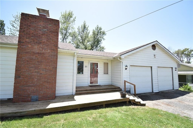 211 Southside Ct, Excelsior Springs, MO 64024 - view of front of home featuring a chimney and an attached garage