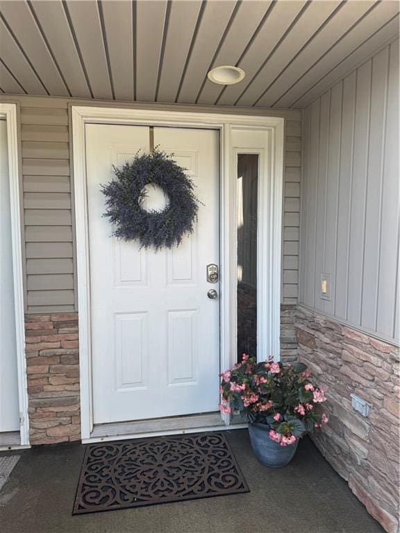 21086 Millridge St, Spring Hill, KS 66083 - property entrance featuring stone siding