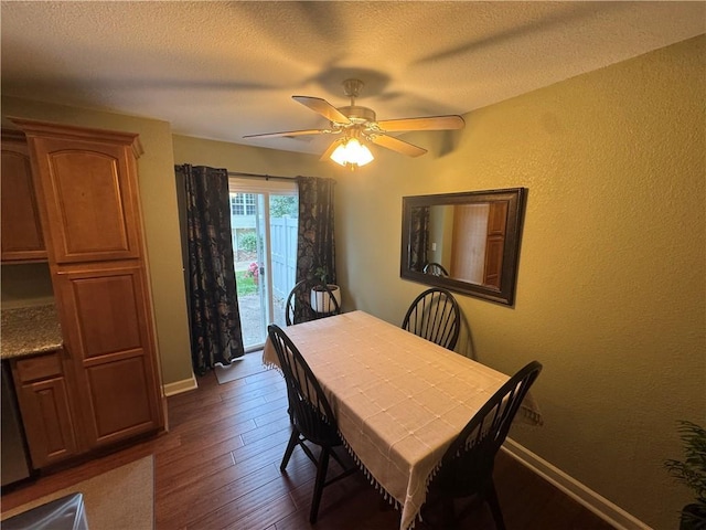 21086 Millridge St, Spring Hill, KS 66083 - dining room with dark wood-type flooring, a ceiling fan, and a textured ceiling