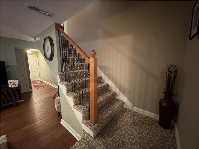 21086 Millridge St, Spring Hill, KS 66083 - staircase featuring hardwood / wood-style flooring and lofted ceiling