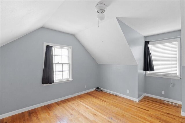 900 S Hunter Dr, Olathe, KS 66061 - bonus room with wood finished floors and vaulted ceiling