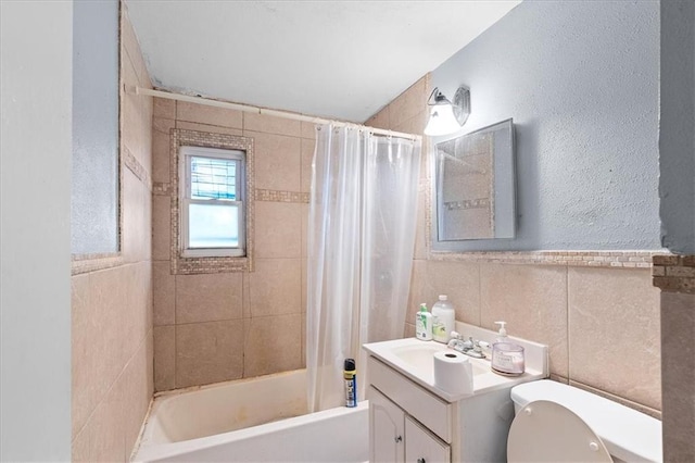 900 S Hunter Dr, Olathe, KS 66061 - full bathroom featuring shower / bath combo, vanity, and tile walls