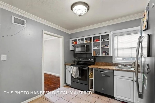 900 S Hunter Dr, Olathe, KS 66061 - kitchen with stainless steel appliances, light tile patterned floors, open shelves, ornamental molding, and white cabinetry