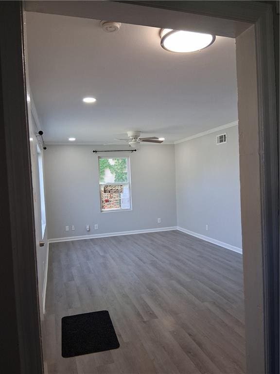 3304 Norton St, Kansas City, MO 64128 - empty room featuring crown molding, a ceiling fan, wood finished floors, and recessed lighting