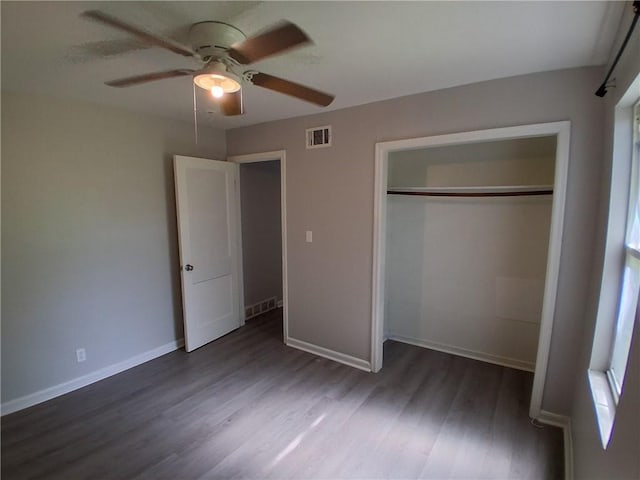 3304 Norton St, Kansas City, MO 64128 - unfurnished bedroom featuring wood finished floors, a closet, and a ceiling fan