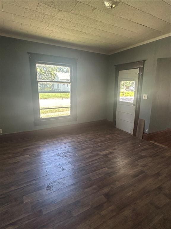 209 S Prairie, Yates Center, KS 66783 - unfurnished room featuring dark wood finished floors and crown molding