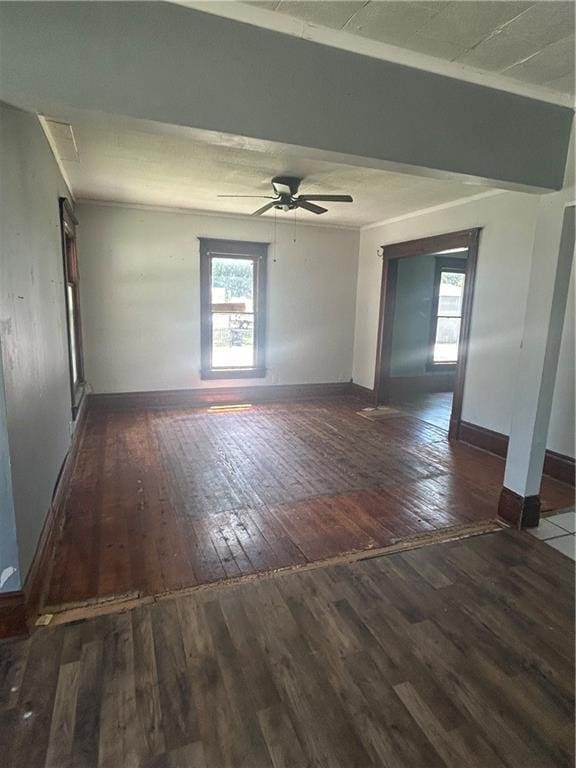 209 S Prairie, Yates Center, KS 66783 - empty room with hardwood / wood-style flooring, healthy amount of natural light, and ceiling fan