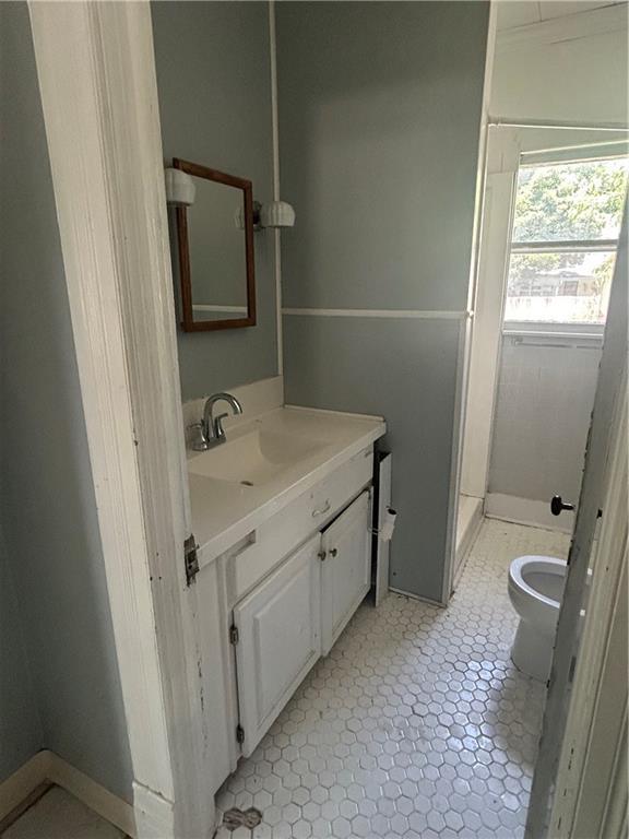 209 S Prairie, Yates Center, KS 66783 - bathroom with toilet and vanity