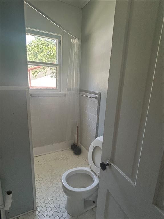 209 S Prairie, Yates Center, KS 66783 - bathroom with toilet and a shower