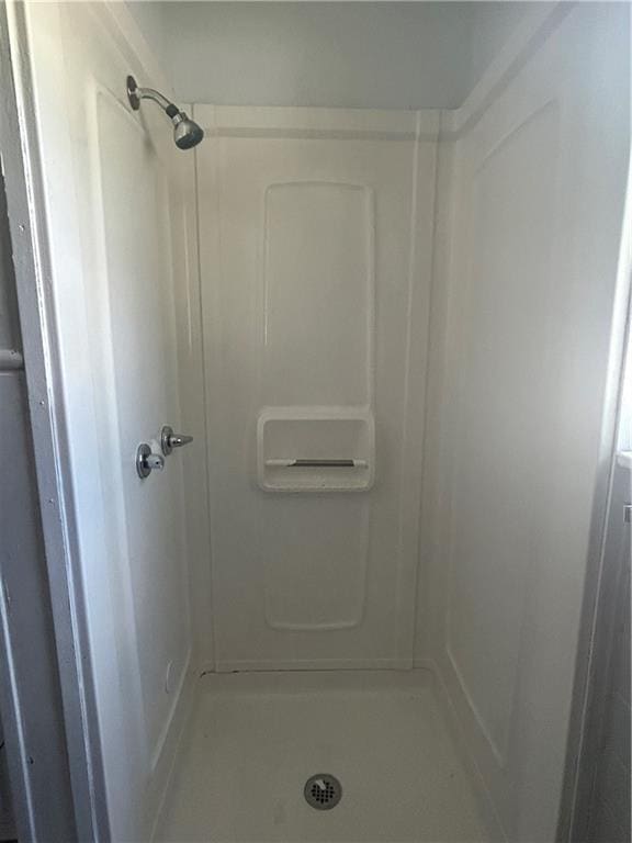 209 S Prairie, Yates Center, KS 66783 - bathroom with a shower