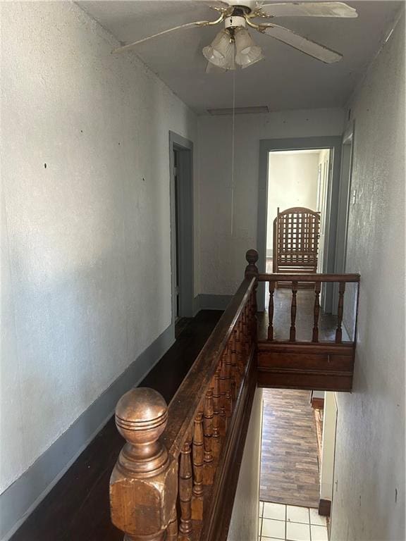 209 S Prairie, Yates Center, KS 66783 - stairway featuring ceiling fan and baseboards