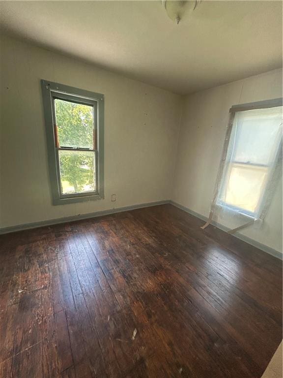 209 S Prairie, Yates Center, KS 66783 - empty room with dark wood finished floors and baseboards