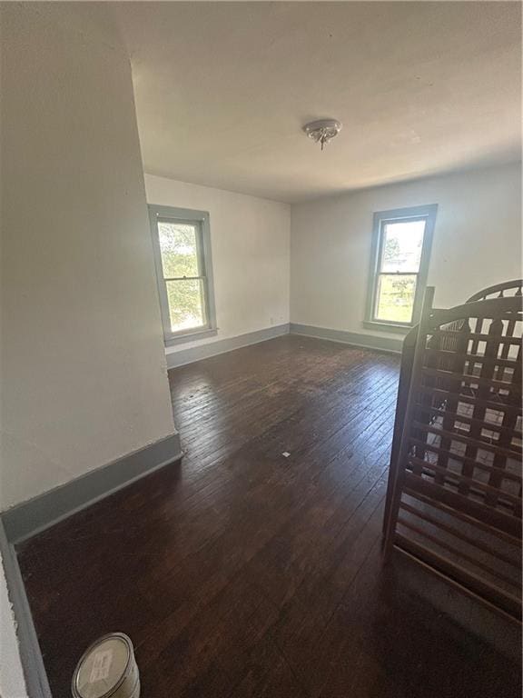209 S Prairie, Yates Center, KS 66783 - empty room featuring dark wood-style flooring and baseboards