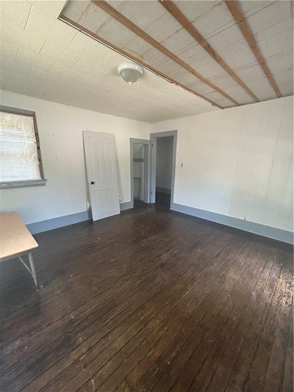 209 S Prairie, Yates Center, KS 66783 - empty room featuring wood-type flooring and baseboards