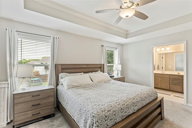 20335 W 220th Ter, Spring Hill, KS 66083 - bedroom with light colored carpet, a raised ceiling, ornamental molding, connected bathroom, and a ceiling fan
