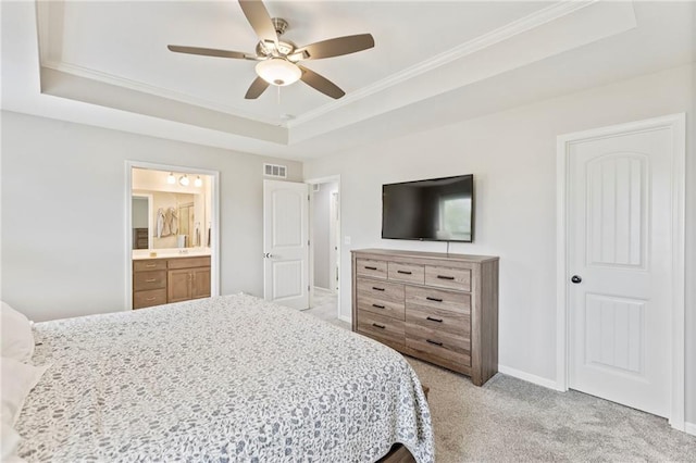 20335 W 220th Ter, Spring Hill, KS 66083 - bedroom with a tray ceiling, light colored carpet, ornamental molding, ensuite bath, and ceiling fan