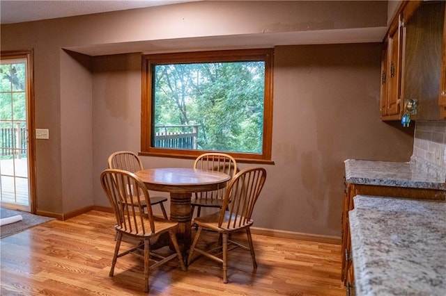 2421 Elephant Trl, Saint Joseph, MO 64506 - dining area with light wood-style floors and baseboards