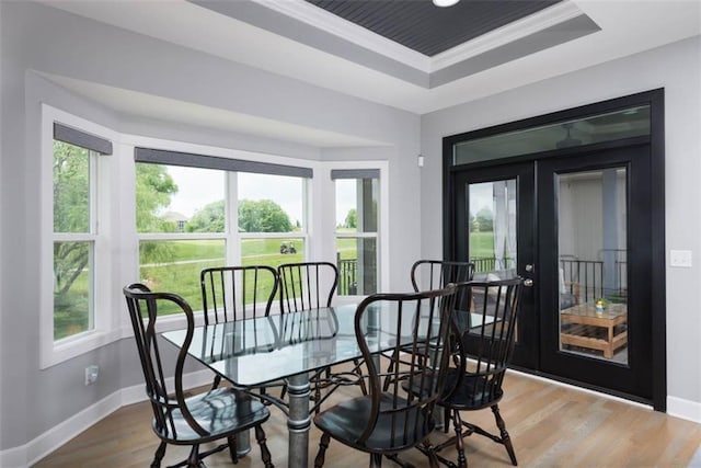14423 N 145th St, Basehor, KS 66007 - dining area with french doors, a tray ceiling, and wood finished floors