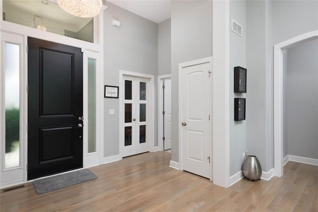 14423 N 145th St, Basehor, KS 66007 - foyer entrance with a high ceiling and light wood-style flooring