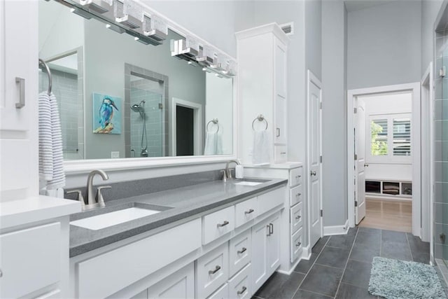 14423 N 145th St, Basehor, KS 66007 - bathroom featuring double vanity, a shower stall, and tile patterned flooring