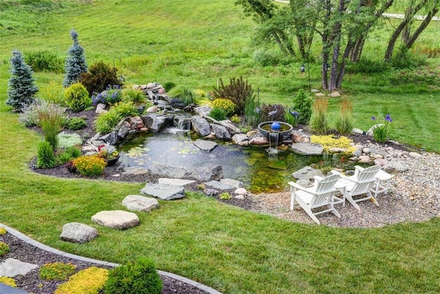 14423 N 145th St, Basehor, KS 66007 - view of green lawn featuring a small pond