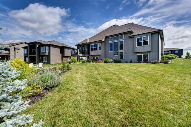14423 N 145th St, Basehor, KS 66007 - rear view of house featuring a lawn