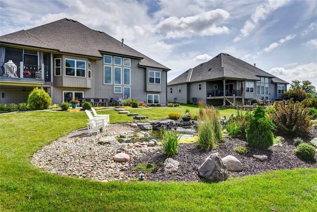14423 N 145th St, Basehor, KS 66007 - back of property featuring a lawn and roof with shingles