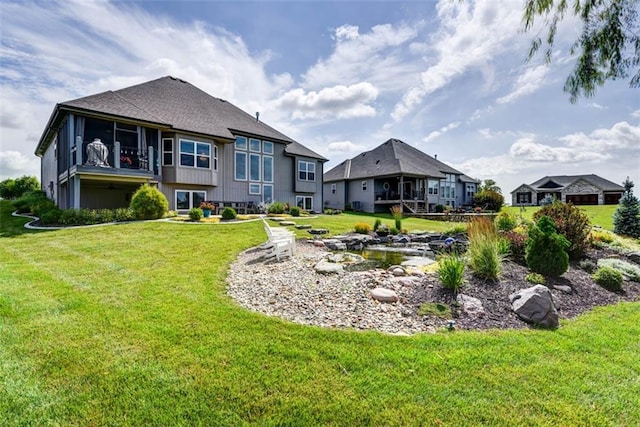 14423 N 145th St, Basehor, KS 66007 - rear view of house featuring a lawn