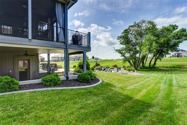14423 N 145th St, Basehor, KS 66007 - view of grassy yard with a balcony and ceiling fan