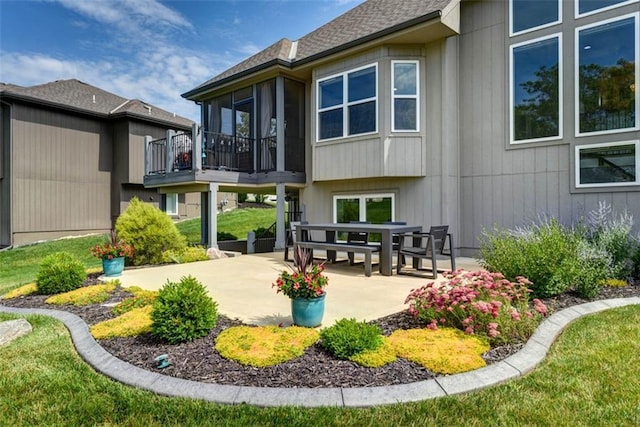 14423 N 145th St, Basehor, KS 66007 - back of house featuring a patio area and a sunroom