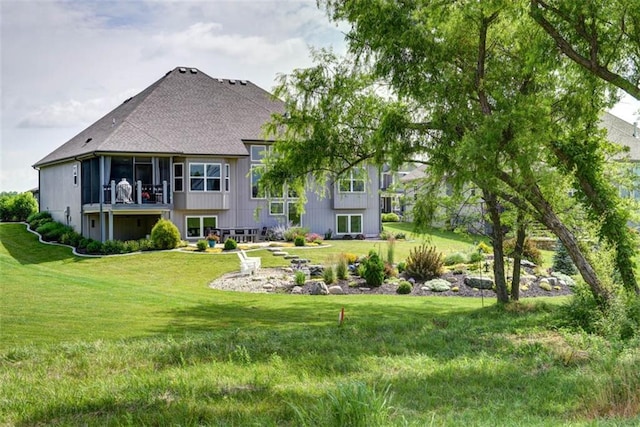 14423 N 145th St, Basehor, KS 66007 - rear view of house with a shingled roof and a yard