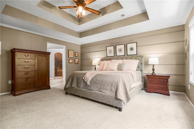 23852 W 124th Ct, Olathe, KS 66061 - carpeted bedroom with a raised ceiling, ornamental molding, and a ceiling fan