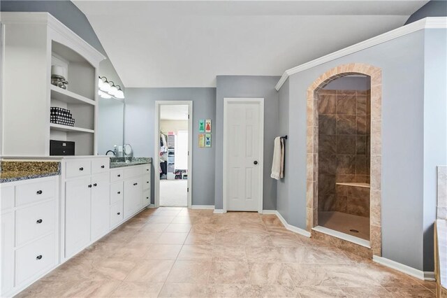 23852 W 124th Ct, Olathe, KS 66061 - bathroom featuring vanity, a tile shower, and vaulted ceiling