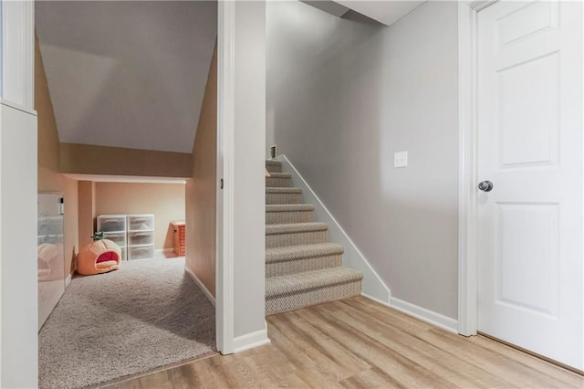 23852 W 124th Ct, Olathe, KS 66061 - stairs featuring wood finished floors and baseboards
