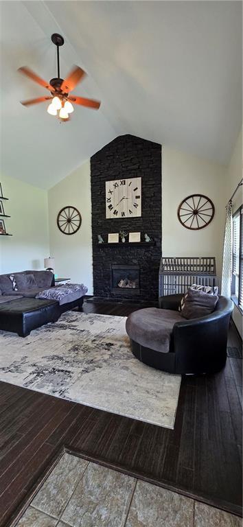 25372 Metro Ave, Tonganoxie, KS 66086 - living room with vaulted ceiling, hardwood / wood-style flooring, ceiling fan, and a fireplace