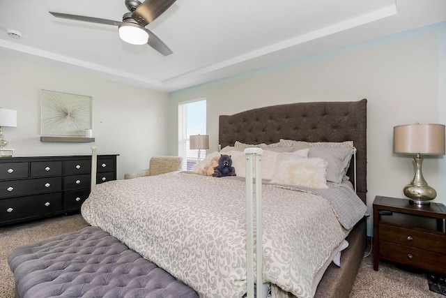 1702 Aspen Ln, Excelsior Springs, MO 64024 - carpeted bedroom featuring ceiling fan and a tray ceiling
