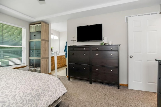 1702 Aspen Ln, Excelsior Springs, MO 64024 - bedroom with light carpet and connected bathroom