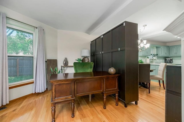 1702 Aspen Ln, Excelsior Springs, MO 64024 - home office featuring light wood-style floors and a chandelier
