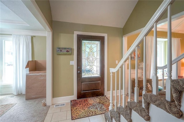 12432 Lamar Ave, Overland Park, KS 66209 - tiled foyer entrance featuring plenty of natural light, stairs, and vaulted ceiling