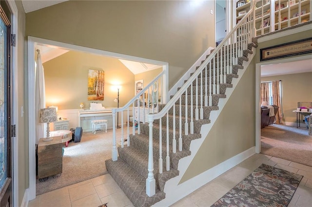 12432 Lamar Ave, Overland Park, KS 66209 - stairs with carpet floors and tile patterned floors