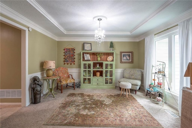 12432 Lamar Ave, Overland Park, KS 66209 - sitting room featuring carpet flooring, a chandelier, ornamental molding, wainscoting, and a tray ceiling