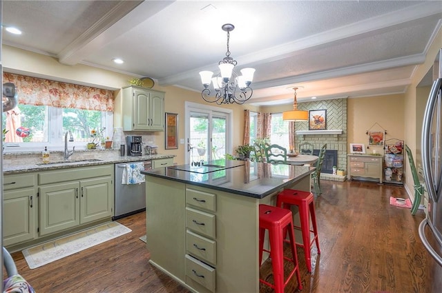 12432 Lamar Ave, Overland Park, KS 66209 - kitchen featuring appliances with stainless steel finishes, green cabinetry, beamed ceiling, crown molding, and a chandelier