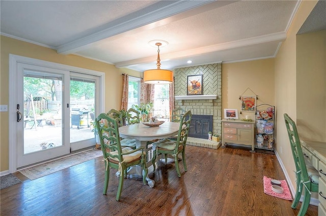 12432 Lamar Ave, Overland Park, KS 66209 - dining space featuring beamed ceiling, ornamental molding, wood finished floors, and a fireplace