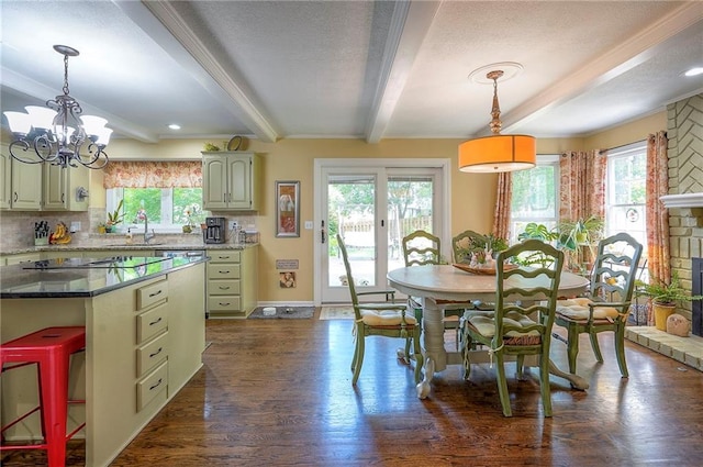 12432 Lamar Ave, Overland Park, KS 66209 - dining space with beamed ceiling, healthy amount of natural light, dark wood-style flooring, a chandelier, and a textured ceiling