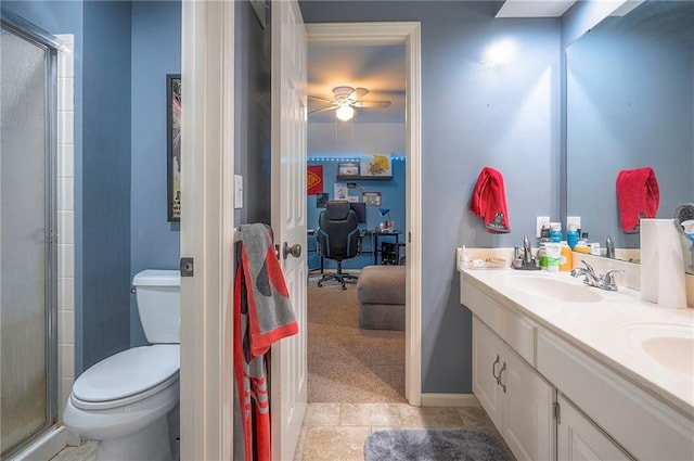 12432 Lamar Ave, Overland Park, KS 66209 - bathroom with connected bathroom, double vanity, ceiling fan, and a shower with door