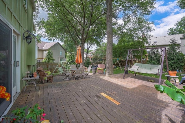 12432 Lamar Ave, Overland Park, KS 66209 - deck featuring a fenced backyard and outdoor dining area